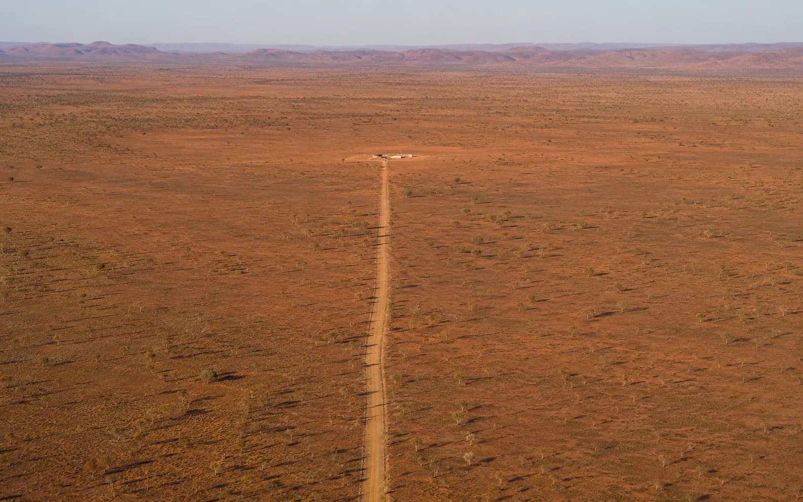 Remote NT landscape with a small civil compound and access track